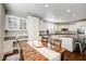 Spacious kitchen with an island, white cabinets, and granite countertops at 8593 Garden Valley Ct, Las Vegas, NV 89178