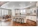 Modern kitchen with white cabinets, granite countertops, and stainless steel appliances at 8593 Garden Valley Ct, Las Vegas, NV 89178