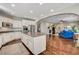 Modern kitchen with white cabinets, granite countertops, and stainless steel appliances at 8593 Garden Valley Ct, Las Vegas, NV 89178