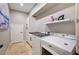 Laundry room with washer, dryer, and built-in cabinets at 8593 Garden Valley Ct, Las Vegas, NV 89178