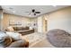 Relaxing living room featuring a sectional sofa and a beanbag chair at 8593 Garden Valley Ct, Las Vegas, NV 89178