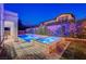 Relaxing pool and spa with lighting and landscaping at 8593 Garden Valley Ct, Las Vegas, NV 89178