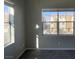 Bedroom with large windows offering a view of the neighborhood at 8777 W Maule Ave # 2109, Las Vegas, NV 89148