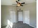 Well-lit bedroom with ceiling fan and ample closet space at 8777 W Maule Ave # 2109, Las Vegas, NV 89148