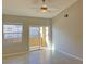 Bright bedroom with tile flooring and balcony access at 8777 W Maule Ave # 2109, Las Vegas, NV 89148