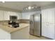 Modern kitchen with stainless steel appliances and white cabinets at 8777 W Maule Ave # 2109, Las Vegas, NV 89148