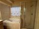 Bathroom with shower and a separate tub at 8916 Stafford Springs Dr, Las Vegas, NV 89134