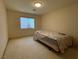 Small bedroom with window and carpet flooring at 8916 Stafford Springs Dr, Las Vegas, NV 89134