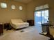 Bright bedroom with sliding glass doors to patio at 8916 Stafford Springs Dr, Las Vegas, NV 89134