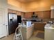 Kitchen with stainless steel appliances and light wood cabinets at 8916 Stafford Springs Dr, Las Vegas, NV 89134