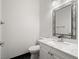 Bathroom with white vanity, marble countertop, and ornate mirror at 9523 Cherrydale Ct, Las Vegas, NV 89147