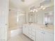 Bathroom with double vanity, tub and window at 9523 Cherrydale Ct, Las Vegas, NV 89147