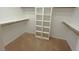 Walk-in closet with shelves and hanging rods at 9523 Cherrydale Ct, Las Vegas, NV 89147