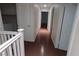 Upstairs hallway with light brown flooring and white doors at 9523 Cherrydale Ct, Las Vegas, NV 89147