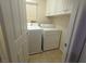 Laundry room with washer, dryer, and cabinets at 9523 Cherrydale Ct, Las Vegas, NV 89147