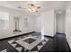 Living room with a geometric tile floor, mirror, and high ceilings at 9523 Cherrydale Ct, Las Vegas, NV 89147