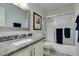 Clean bathroom, featuring granite countertop and updated vanity at 1005 Sulphur Springs Ln # 202, Las Vegas, NV 89128