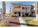 Two-story condo building with a walkway and landscaping at 1005 Sulphur Springs Ln # 202, Las Vegas, NV 89128