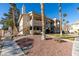 Condo building with palm trees and walkway at 1005 Sulphur Springs Ln # 202, Las Vegas, NV 89128