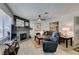 Living room with a corner fireplace, ceiling fan, and hardwood floors at 1005 Sulphur Springs Ln # 202, Las Vegas, NV 89128