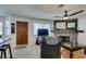 Living room with fireplace, hardwood floors, and a ceiling fan at 1005 Sulphur Springs Ln # 202, Las Vegas, NV 89128