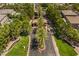 Gated community entrance with lush landscaping and palm trees at 10968 Fintry Hills St, Las Vegas, NV 89141