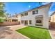 Landscaped backyard with artificial turf and pavers at 10968 Fintry Hills St, Las Vegas, NV 89141