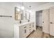 Modern bathroom with double vanity, quartz countertop, and walk-in shower at 10968 Fintry Hills St, Las Vegas, NV 89141