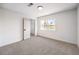 Bright bedroom with neutral carpeting and an ensuite closet at 10968 Fintry Hills St, Las Vegas, NV 89141