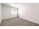 Well-lit bedroom featuring neutral walls and carpet at 10968 Fintry Hills St, Las Vegas, NV 89141