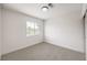 Simple bedroom with neutral walls, carpet, and a window at 10968 Fintry Hills St, Las Vegas, NV 89141