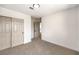 Bedroom with sliding doors and neutral walls and carpet at 10968 Fintry Hills St, Las Vegas, NV 89141