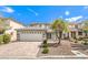 Two-story house with a large driveway and nicely landscaped yard at 10968 Fintry Hills St, Las Vegas, NV 89141