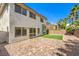 Two-story house exterior with backyard access and landscaping at 10968 Fintry Hills St, Las Vegas, NV 89141