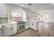 Modern kitchen with white cabinets and stainless steel appliances at 10968 Fintry Hills St, Las Vegas, NV 89141