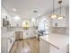 Modern kitchen with white cabinets, stainless steel appliances, and quartz countertops at 10968 Fintry Hills St, Las Vegas, NV 89141