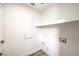 Laundry room with white cabinets and a built in shelf at 10968 Fintry Hills St, Las Vegas, NV 89141