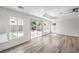 Bright and airy living room with hardwood floors and sliding doors to backyard at 10968 Fintry Hills St, Las Vegas, NV 89141