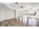 Bright and airy living room with hardwood floors and sliding doors to backyard at 10968 Fintry Hills St, Las Vegas, NV 89141