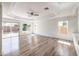 Bright and airy living room with hardwood floors and sliding doors to backyard at 10968 Fintry Hills St, Las Vegas, NV 89141