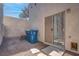 Small backyard with gravel and a sliding glass door at 1167 Vacation Valley Ave, Las Vegas, NV 89183