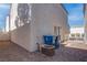 Backyard view with gravel, air conditioning unit and trash bins at 1167 Vacation Valley Ave, Las Vegas, NV 89183