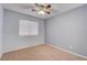 Spacious bedroom with ceiling fan and window blinds at 1167 Vacation Valley Ave, Las Vegas, NV 89183