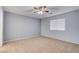 Spacious bedroom with ceiling fan and carpet at 1167 Vacation Valley Ave, Las Vegas, NV 89183