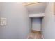 Small under-stair closet with carpeted floor at 1167 Vacation Valley Ave, Las Vegas, NV 89183