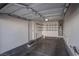 Garage with shelving and water heater at 1167 Vacation Valley Ave, Las Vegas, NV 89183