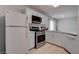 Modern kitchen with stainless steel appliances and white cabinets at 1167 Vacation Valley Ave, Las Vegas, NV 89183