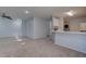 Kitchen features a breakfast bar and white cabinets at 1167 Vacation Valley Ave, Las Vegas, NV 89183