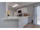 Modern kitchen with an island and white cabinets at 1167 Vacation Valley Ave, Las Vegas, NV 89183