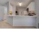 Modern kitchen with an island and white cabinets at 1167 Vacation Valley Ave, Las Vegas, NV 89183